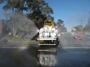 Magnumaustralia Gallery Magnumtruck Being Driven On Road With Water Dispersal From Rear