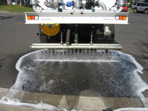 Magnumaustralia Gallery Magnumtruck Being Driven On Road With Water Dispersal On Ground